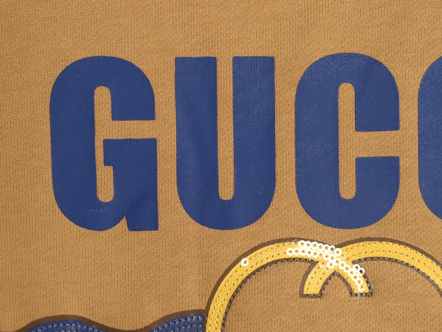 G*u*i hoodies