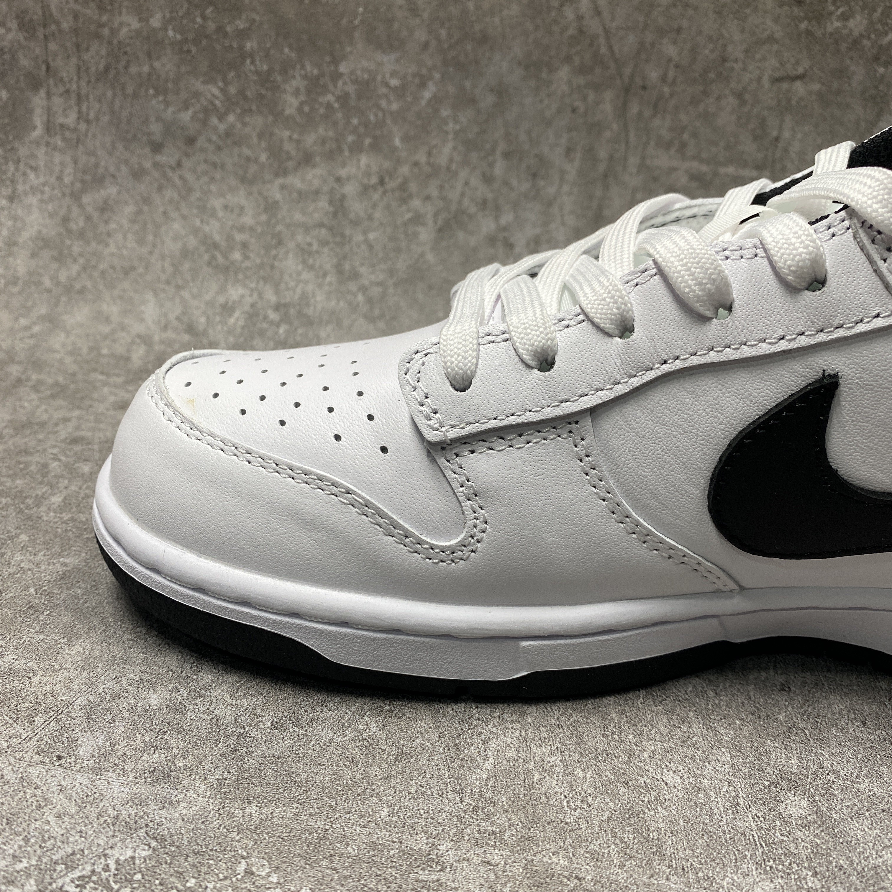 nike dunk low surF**es in clean white and black