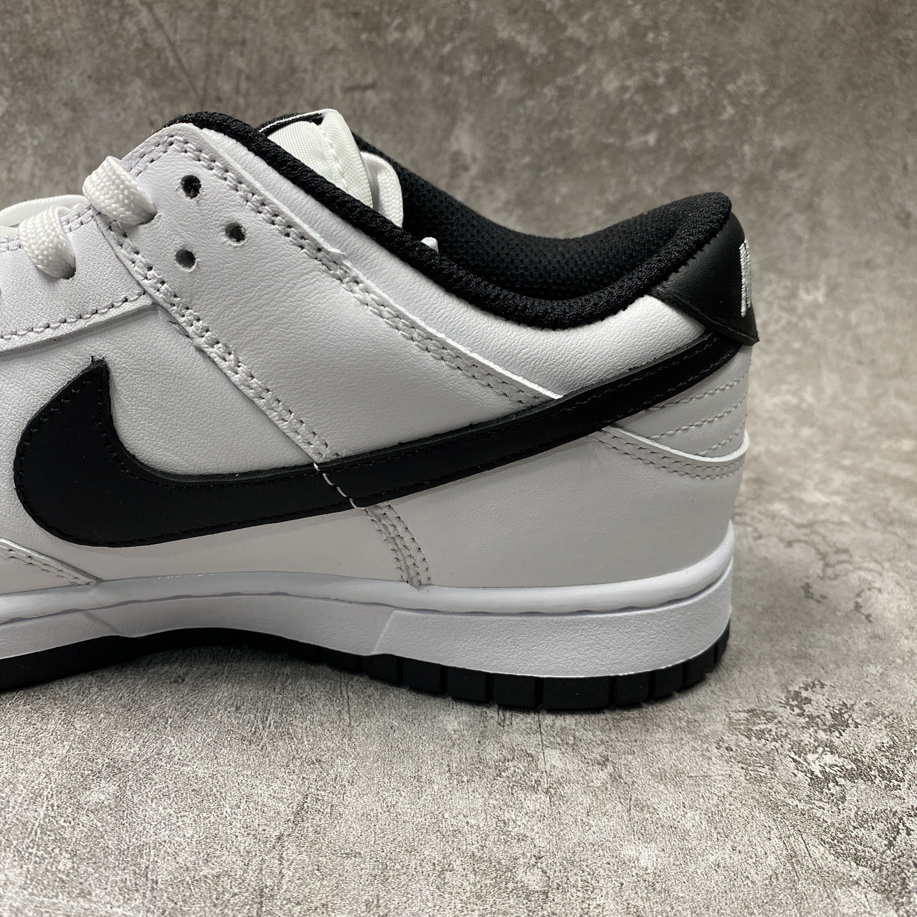 nike dunk low surF**es in clean white and black