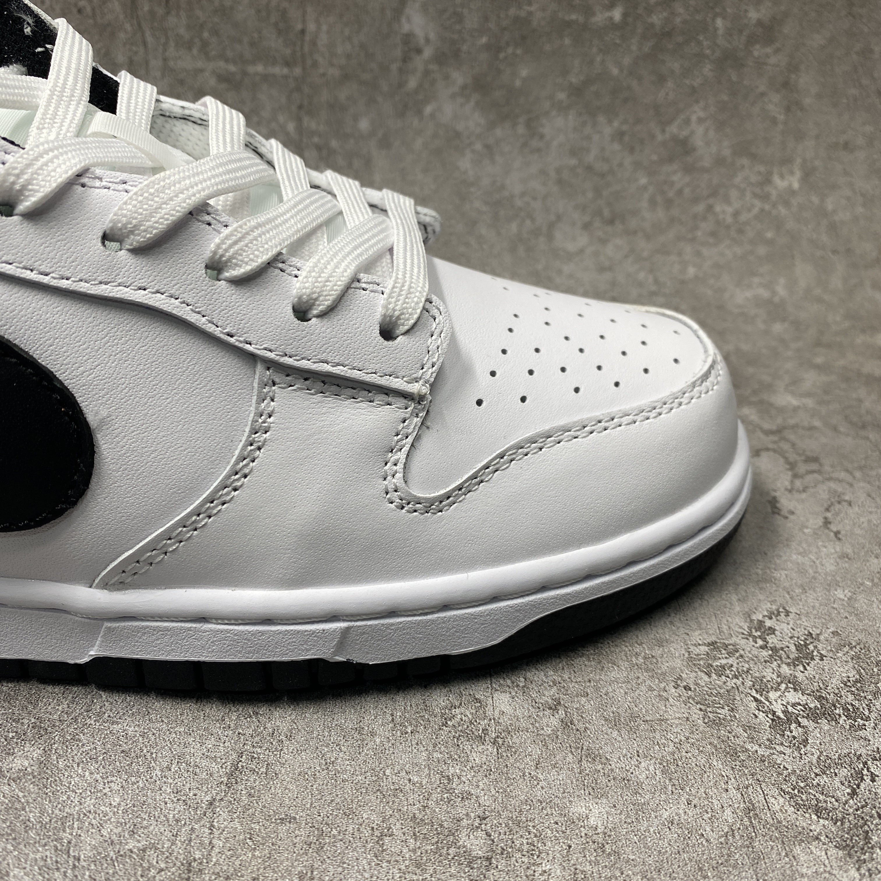 nike dunk low surF**es in clean white and black